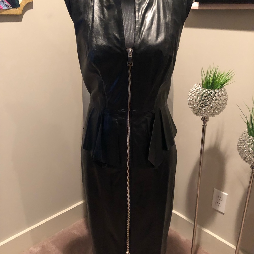 Leather peplum midi dress.